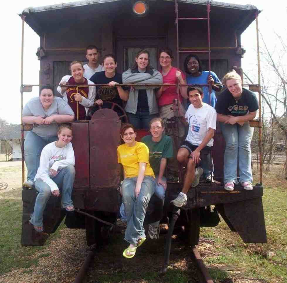 Group pictured on back of train